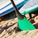 Two paddles are planted in the sand near a row of stand up paddle boards